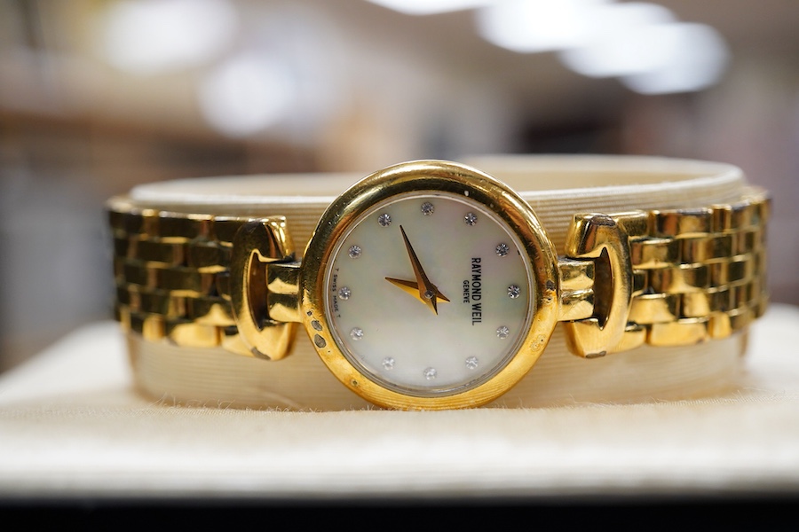 A lady's 2002 gilt steel Raymond Weil quartz wrist watch, with mother of pearl dial and simulated diamond dot numerals, with box and papers.